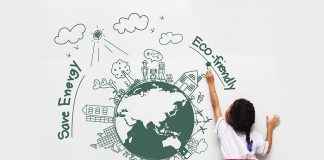 25 Must Know Planet Earth Facts for Kids A little girl drawing a creative of the Earth on a wall