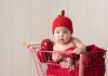 4 to 6 Months Old Baby Food Ideas A baby wearing an apple hat