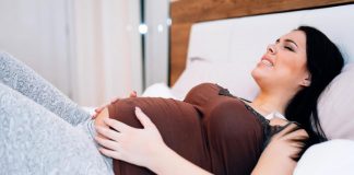 Urinary Tract Infection (UTI) during Pregnancy A pregnant woman suffering from cramps