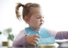 How to Handle a Fussy Eater Toddler A little girl making faces while eating