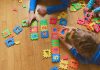 15 Number Recognition Activities for Preschool Kids Kids playing with number puzzle
