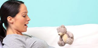 Baby Hiccups in Womb During Pregnancy A pregnant woman with her hand on belly