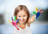 10 Easy Thumb and Finger Painting Ideas for Kids A little girl with paint all over her hands