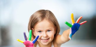 10 Easy Thumb and Finger Painting Ideas for Kids A little girl with paint all over her hands
