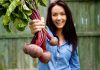 Beetroot in Pregnancy – Health Benefits and Side Effects A woman holding fresh beetroots