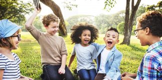 30 Indoor and Outdoor Physical Activities for Kids A group of kids paying outdoors