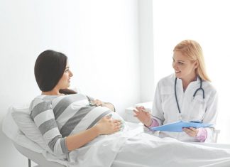 Losing Mucus Plug during Pregnancy A pregnant woman at doctor's