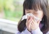 Allergies in Kids – Causes, Symptoms and Treatment A little girl sneezing because of an allergy