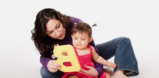 How to Teach Kids Alphabets A mother teaching alphabets to her baby
