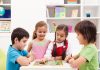 25 Best Board Games for Kids Four kids playing a board game