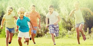 7 Best Running Games for Kids Kids running on the grass in summer