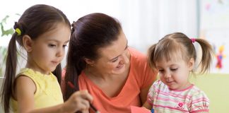 Simple Origami Flowers Ideas for Kids Two little girls making origami flowers with their mother