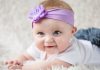 Your 23 Week Old Baby – Development, Milestones & Care A baby girl wearing a purple hairband