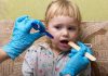 Scarlet Fever in Babies and Toddlers A doctor examining scarlet fever in babies