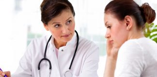 11 Common Types of Female Fertility Tests A woman at doctor's office