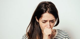 Pneumonia in Pregnancy – Causes, Signs and Treatment A woman coughing