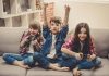 Impact of Video Games on Children – The Good and the Bad Three kids playing video games